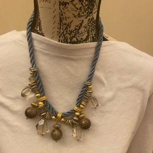 Blue cord necklace with pretty acrylic beads with gold metal accents